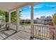 A view from the front porch with white railings and pillars, offering a look at the street at 898 Allene Sw Ave, Atlanta, GA 30310