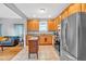 Open kitchen with stainless appliances, wood cabinets and easy access to the living room at 898 Allene Sw Ave, Atlanta, GA 30310