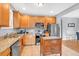 Bright kitchen featuring wooden cabinets, granite countertops, and stainless steel appliances at 898 Allene Sw Ave, Atlanta, GA 30310