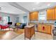 Open-concept kitchen view with stainless appliances and an island connecting to the living room at 898 Allene Sw Ave, Atlanta, GA 30310