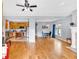 Open-concept living room with hardwood floors, connecting to a kitchen with stainless steel appliances at 898 Allene Sw Ave, Atlanta, GA 30310