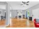 Open-concept living room featuring a fireplace, hardwood floors, and natural light at 898 Allene Sw Ave, Atlanta, GA 30310