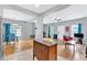 Open concept living and dining room with hardwood floors and stainless appliances at 898 Allene Sw Ave, Atlanta, GA 30310