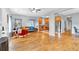 Open-concept living room with hardwood floors, connecting to a kitchen with stainless steel appliances at 898 Allene Sw Ave, Atlanta, GA 30310