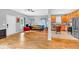 Open-concept living room with hardwood floors, connecting to a kitchen with stainless steel appliances at 898 Allene Sw Ave, Atlanta, GA 30310