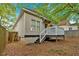 View of the rear exterior of the house from the back yard, featuring a wood deck at 898 Allene Sw Ave, Atlanta, GA 30310