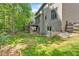 Exterior backyard view with a deck, patio, steps, and lush green grass at 905 Fox Croft Pl, Canton, GA 30114