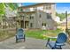Spacious backyard featuring a deck with outdoor seating, surrounded by lush greenery at 905 Fox Croft Pl, Canton, GA 30114