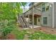 An amazing outdoor space featuring a spacious wooden deck and stairs leading to a lush green yard, perfect for relaxation and entertaining at 905 Fox Croft Pl, Canton, GA 30114