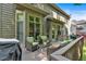 Rear exterior view of the home from the deck featuring comfortable seating and a grill at 905 Fox Croft Pl, Canton, GA 30114