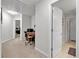 Bright hallway with doorways to the bathroom and bedroom, and a view to an office area at 905 Fox Croft Pl, Canton, GA 30114