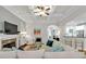 Open living area with coffered ceiling, stone fireplace, and views to the kitchen at 905 Fox Croft Pl, Canton, GA 30114