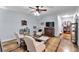 Bright living room with comfortable furniture and decor, illuminated by a modern ceiling fan at 905 Fox Croft Pl, Canton, GA 30114