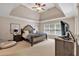 Spacious main bedroom with vaulted ceiling, ceiling fan, and large windows at 905 Fox Croft Pl, Canton, GA 30114