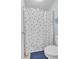 Bathroom with shower featuring polka dot shower curtain, tile floor, and toilet at 905 Fox Croft Pl, Canton, GA 30114