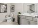 Well-lit bathroom features a modern vanity with storage and a neutral color palette at 102 Holt Ln, Lawrenceville, GA 30046