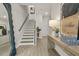 Stylish entryway with modern decor, decorative mirror, and staircase leading upstairs at 102 Holt Ln, Lawrenceville, GA 30046