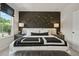 Main bedroom with a neutral color scheme, lots of natural light and a dark accent wall at 102 Holt Ln, Lawrenceville, GA 30046