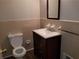 Traditional bathroom with a vanity sink, toilet, and tile flooring and walls at 1170 Blair Bridge Rd, Austell, GA 30168