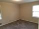 Cozy bedroom with soft carpet and natural light from the window at 1170 Blair Bridge Rd, Austell, GA 30168