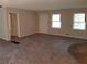 Inviting living room features plenty of natural light and neutral carpet at 1170 Blair Bridge Rd, Austell, GA 30168