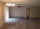 Modern living room with neutral walls, soft carpet, and modern lighting at 1170 Blair Bridge Rd, Austell, GA 30168