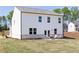 Spacious backyard with a patio and cozy outdoor seating arrangement at 1771 Jordan Brook Dr, Lawrenceville, GA 30043