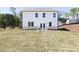 Expansive backyard with patio seating, ideal for outdoor entertaining at 1771 Jordan Brook Dr, Lawrenceville, GA 30043