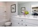 Bright bathroom features double vanity sinks, modern fixtures, and a convenient laundry area at 1771 Jordan Brook Dr, Lawrenceville, GA 30043