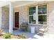 Comfortable front porch featuring a cozy seating arrangement and view of the home at 1771 Jordan Brook Dr, Lawrenceville, GA 30043