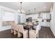 View of the kitchen with a large island, stainless steel appliances, and a dining table at 1771 Jordan Brook Dr, Lawrenceville, GA 30043
