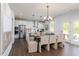 Eat-in kitchen with a large island, stainless steel appliances, and a dining table at 1771 Jordan Brook Dr, Lawrenceville, GA 30043