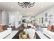 Open-concept living room and kitchen with hardwood floors and modern decor at 1771 Jordan Brook Dr, Lawrenceville, GA 30043