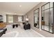 Comfortable living room showcasing a large sectional sofa, a round coffee table, and neutral tones at 1771 Jordan Brook Dr, Lawrenceville, GA 30043