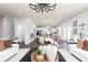 Open-concept living room and kitchen with hardwood floors and modern decor at 1771 Jordan Brook Dr, Lawrenceville, GA 30043
