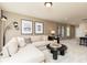 Bright living room with comfortable seating, modern lighting, and decorative art prints create an inviting atmosphere at 1771 Jordan Brook Dr, Lawrenceville, GA 30043