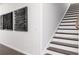 Modern staircase with white risers and dark wood treads complements the stylish interior design at 1771 Jordan Brook Dr, Lawrenceville, GA 30043