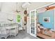 Cozy screened porch with comfortable seating, ceiling fans, and access to an indoor living space at 20 S Prado Ne, Atlanta, GA 30309