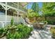 Multi-level deck and patio area with outdoor dining and lush garden, creating a serene retreat at 20 S Prado Ne, Atlanta, GA 30309