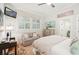 Comfortable bedroom with a small sitting area, neutral palette and a mounted TV at 20 S Prado Ne, Atlanta, GA 30309