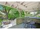 Outdoor deck featuring a hot tub, table and chairs with a leafy view of the backyard at 20 S Prado Ne, Atlanta, GA 30309
