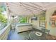 Outdoor deck with a hot tub and a staircase and equipped with a table, chairs, and lights at 20 S Prado Ne, Atlanta, GA 30309