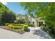 Beautifully landscaped home featuring a manicured lawn and inviting circular driveway at 20 S Prado Ne, Atlanta, GA 30309