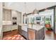 Open-concept kitchen with a large island, stainless steel appliances, and seamless flow to the living area at 20 S Prado Ne, Atlanta, GA 30309