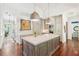 Gourmet kitchen boasts a large island with seating, custom cabinetry, and stainless steel appliances at 20 S Prado Ne, Atlanta, GA 30309