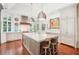 Bright kitchen features an island with seating, custom cabinets, and stainless steel appliances at 20 S Prado Ne, Atlanta, GA 30309
