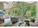 Covered porch features comfortable seating and a grill, perfect for outdoor dining and relaxation at 20 S Prado Ne, Atlanta, GA 30309