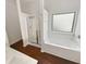 This is a standard bathroom with a shower, tub, and wooden floors at 4428 Belcamp Rd, Fairburn, GA 30213