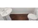 This is a partial view of a standard bathroom with wooden floors at 4428 Belcamp Rd, Fairburn, GA 30213