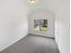 This is a standard bedroom with carpeted floors and a window for natural light at 4428 Belcamp Rd, Fairburn, GA 30213